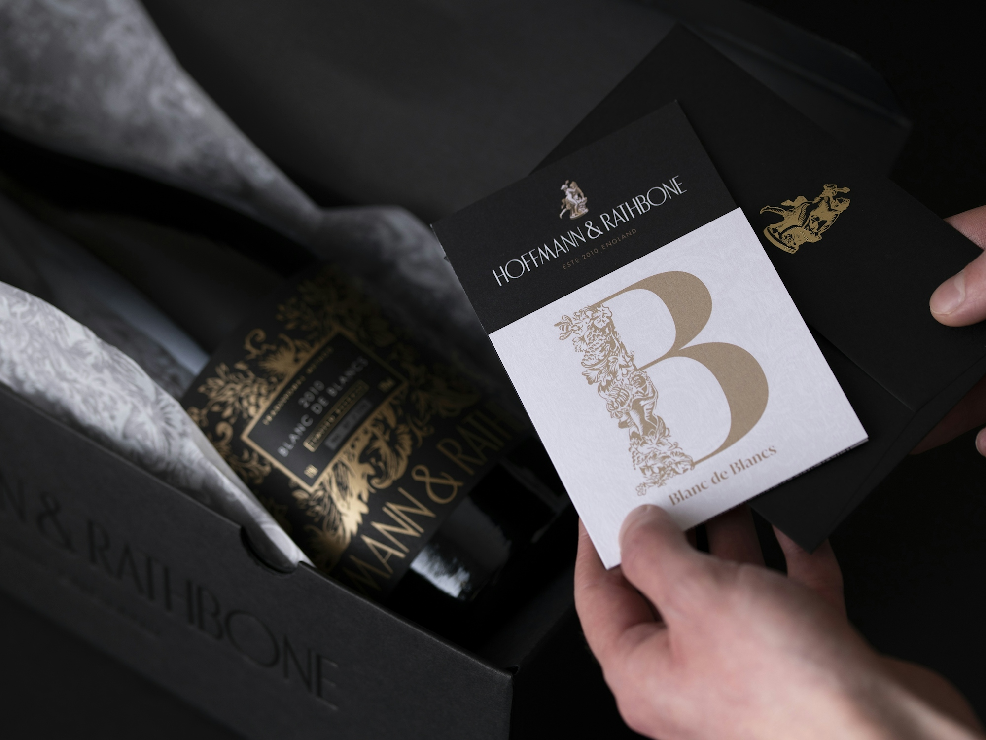 Tissue paper and inserts included in the Hoffmann & Rathbone packaging design.