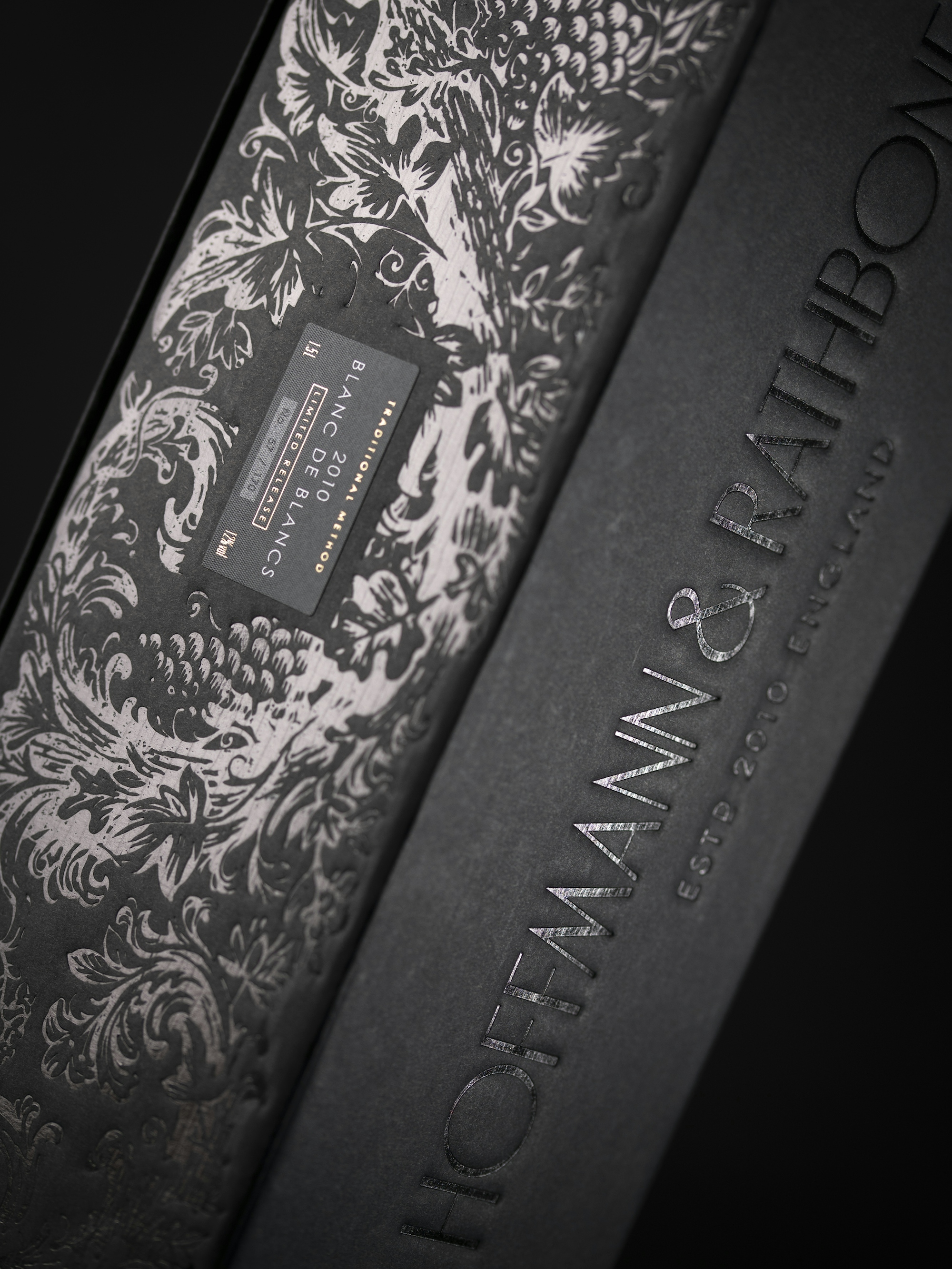 Detail of the spot varnish and blind emboss used on the Hoffmann & Rathbone wine packaging.